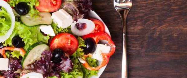 Greek salad on wooden background